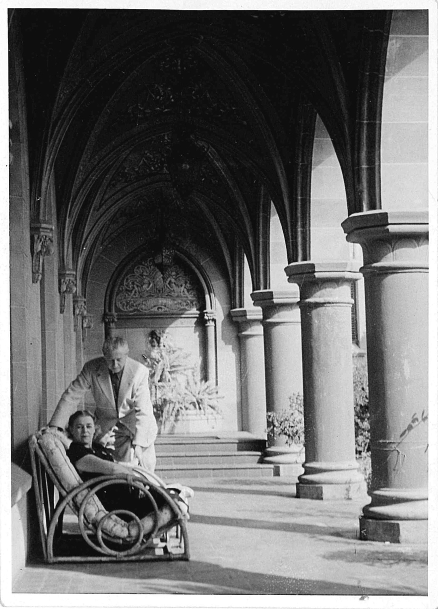 A photograph of Alfred and Kitty sitting in a historic hotel with French architecture