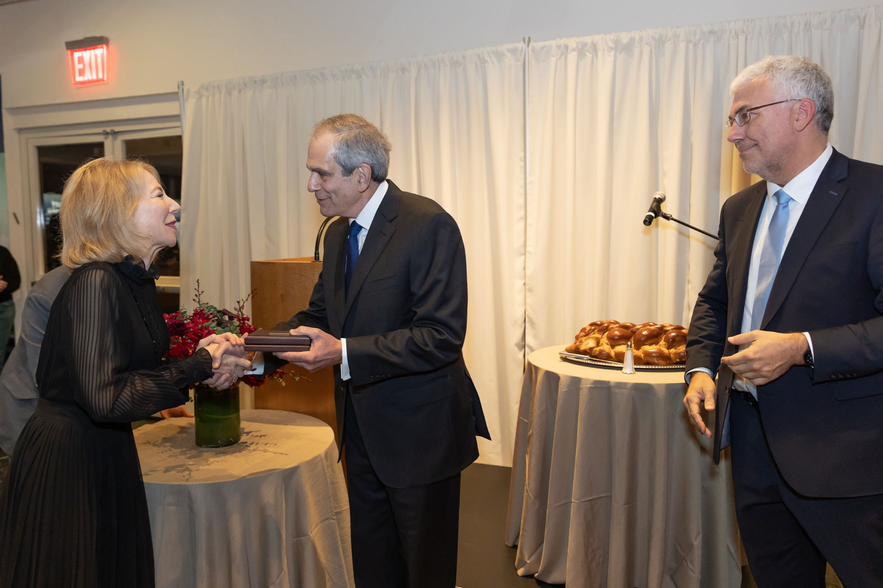 Ambassador Amy Gutmann receiving the medal