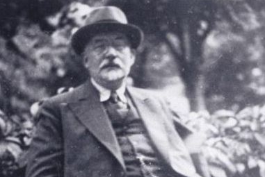 Aron Freimann, seated outdoors.JPG