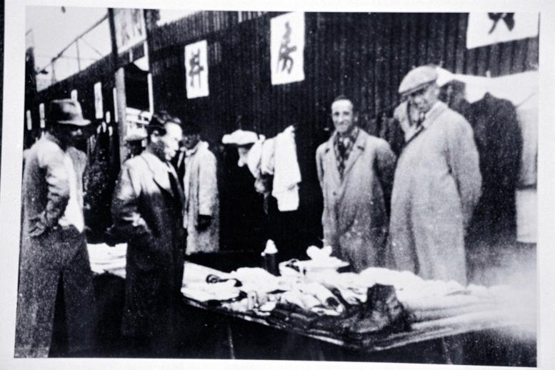 Chinese and Jewish men at street vendor table
