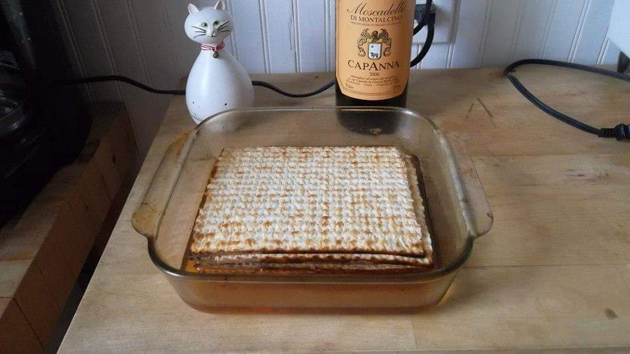 First, four to five matzos are moistened with wine until soft