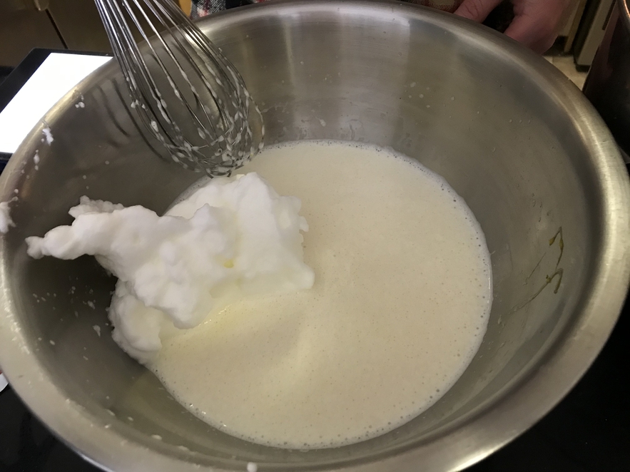 Folding the egg whites into the Kaiserschmarrn batter.