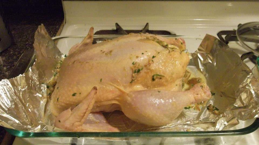 Seasoning the chicken with salt and pepper