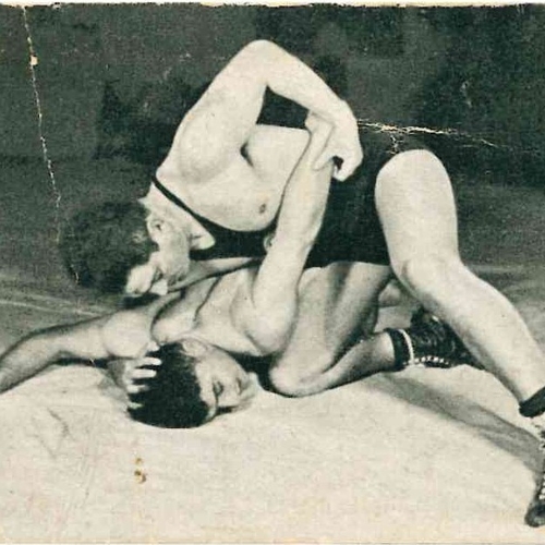 Trading card - Einhorn and Unreich in wrestling pose on mat