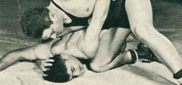 Trading card - Einhorn and Unreich in wrestling pose on mat