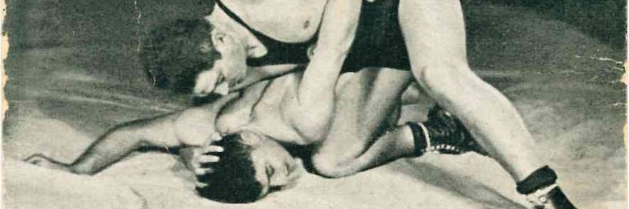 Trading card - Einhorn and Unreich in wrestling pose on mat