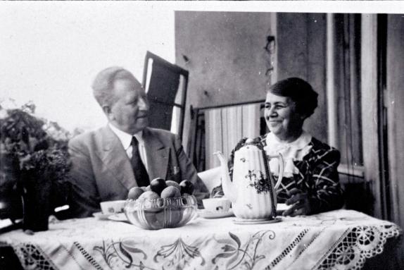 Alfred and Elsa Glass drinking coffee on balcony, c. 1930