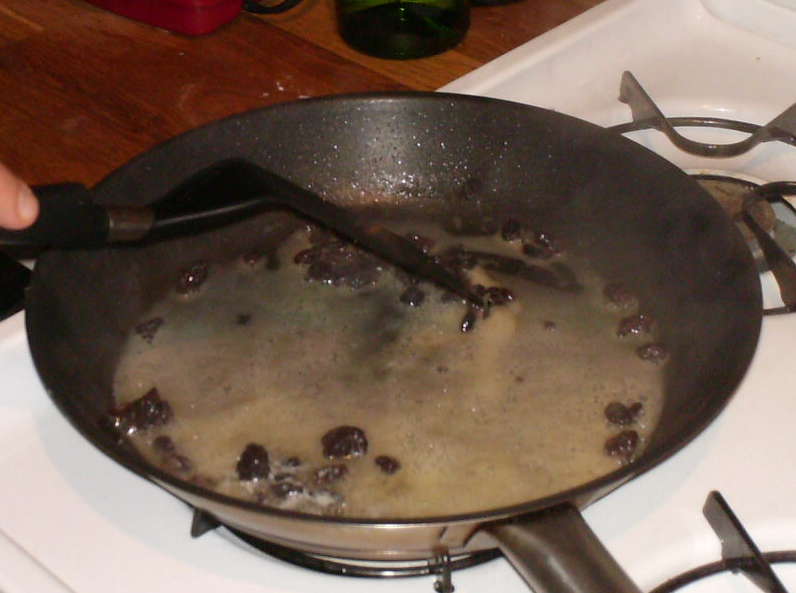 Heating up the mixture of rum, raisins, and butter for the Kaiserschmarrn