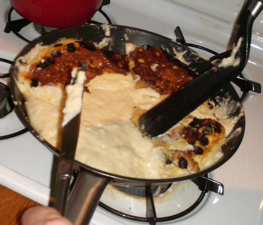 Flipping the Kaiserschmarrn pancake.