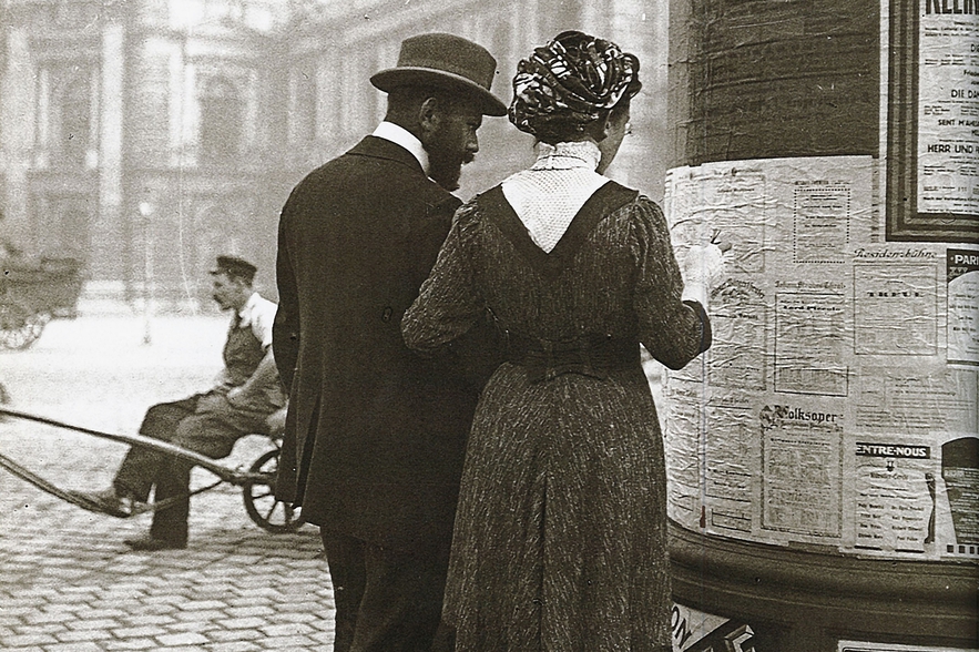 Emil Mayer - Man and Woman at an Advertising Column
